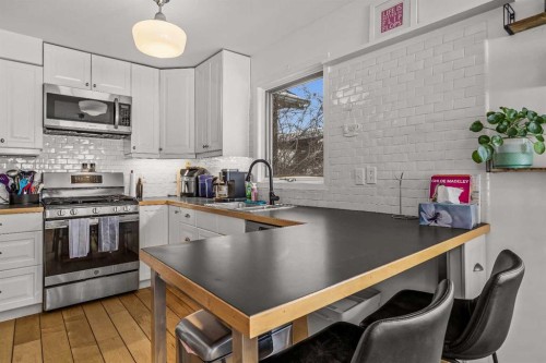 108 Glacier Drive, Banff, AB - Indoor Photo Showing Kitchen With Double Sink With Upgraded Kitchen