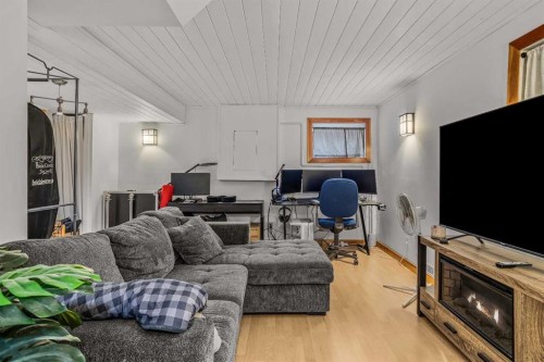 108 Glacier Drive, Banff, AB - Indoor Photo Showing Living Room With Fireplace