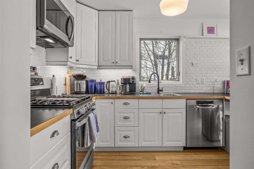 108 Glacier Drive, Banff, AB - Indoor Photo Showing Kitchen With Double Sink