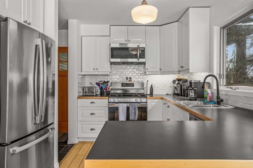 108 Glacier Drive, Banff, AB - Indoor Photo Showing Kitchen With Stainless Steel Kitchen With Double Sink With Upgraded Kitchen