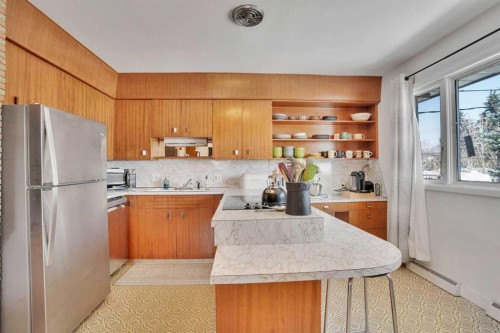 36 Malibou Road Sw, Calgary, AB - Indoor Photo Showing Kitchen With Double Sink