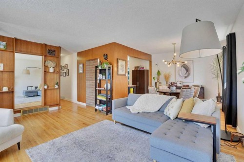 36 Malibou Road Sw, Calgary, AB - Indoor Photo Showing Living Room