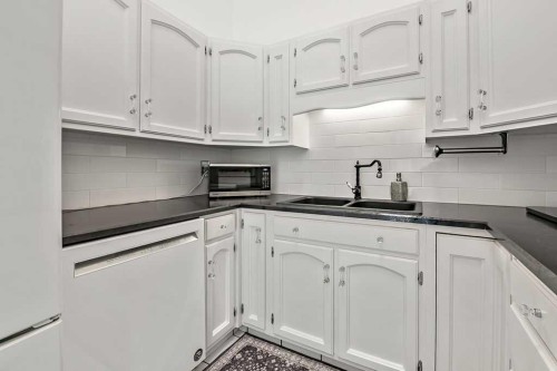 5 Stimson Road Sw, High River, AB - Indoor Photo Showing Kitchen With Double Sink