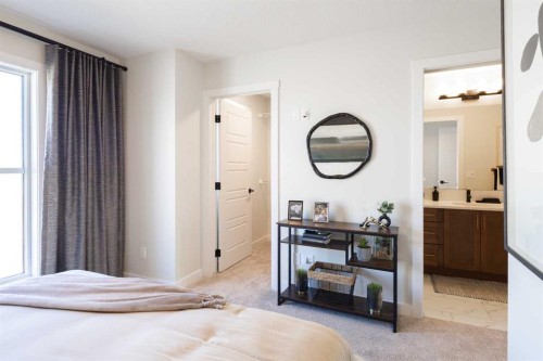 113 Wild Rose Way Se, Calgary, AB - Indoor Photo Showing Bedroom
