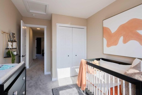 113 Wild Rose Way Se, Calgary, AB - Indoor Photo Showing Bedroom