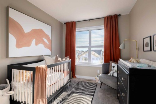 113 Wild Rose Way Se, Calgary, AB - Indoor Photo Showing Bedroom