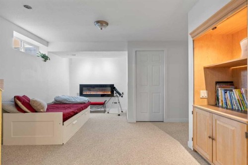 72 Crystalridge Crescent, Okotoks, AB - Indoor Photo Showing Other Room With Fireplace
