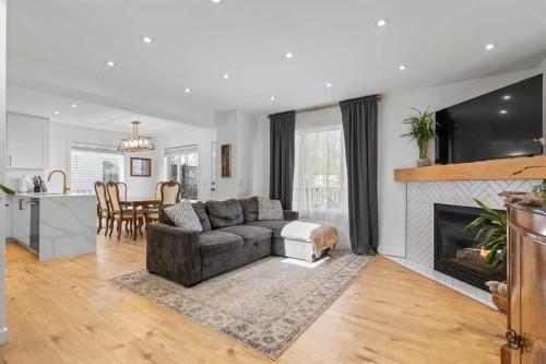 72 Crystalridge Crescent, Okotoks, AB - Indoor Photo Showing Living Room With Fireplace