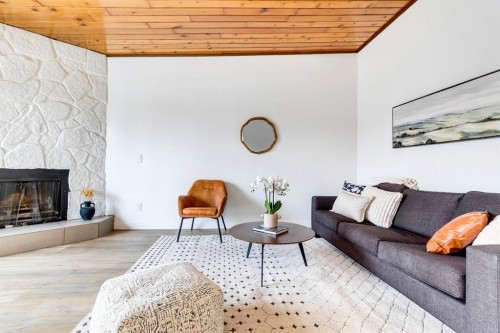 F-1415 44 Street Se, Calgary, AB - Indoor Photo Showing Living Room With Fireplace