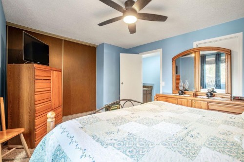 64 Erin Ridge Road Se, Calgary, AB - Indoor Photo Showing Bedroom