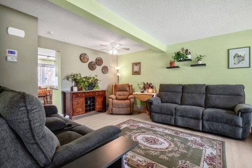 64 Erin Ridge Road Se, Calgary, AB - Indoor Photo Showing Living Room