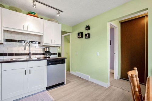 64 Erin Ridge Road Se, Calgary, AB - Indoor Photo Showing Kitchen With Double Sink