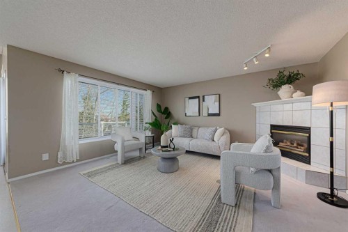 12 Hampstead Gardens Nw, Calgary, AB - Indoor Photo Showing Living Room With Fireplace