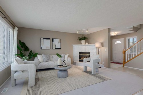 12 Hampstead Gardens Nw, Calgary, AB - Indoor Photo Showing Living Room With Fireplace