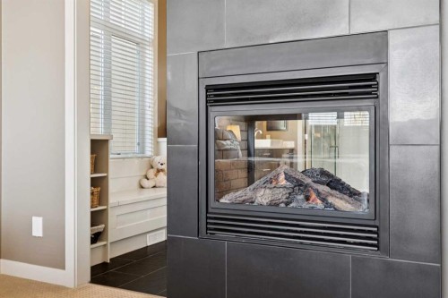 44 Aspen Summit Drive Sw, Calgary, AB - Indoor Photo Showing Other Room With Fireplace