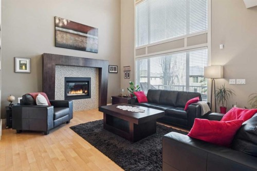 44 Aspen Summit Drive Sw, Calgary, AB - Indoor Photo Showing Living Room With Fireplace