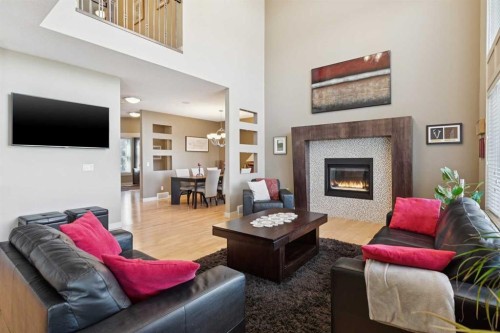 44 Aspen Summit Drive Sw, Calgary, AB - Indoor Photo Showing Living Room With Fireplace