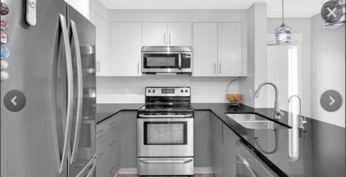 4214-240 Skyview Ranch Road Ne, Calgary, AB - Indoor Photo Showing Kitchen With Stainless Steel Kitchen With Double Sink With Upgraded Kitchen
