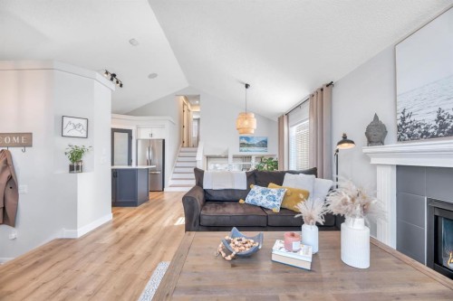 75 Copperfield Rise Se, Calgary, AB - Indoor Photo Showing Living Room With Fireplace