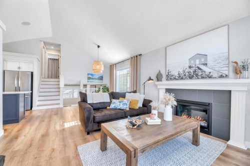 75 Copperfield Rise Se, Calgary, AB - Indoor Photo Showing Living Room With Fireplace
