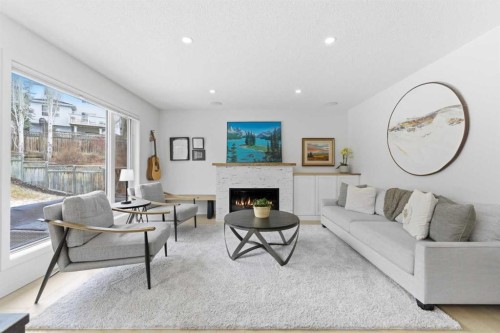 40 Tuscany Ridge Green Nw, Calgary, AB - Indoor Photo Showing Living Room With Fireplace