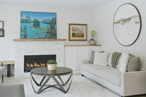 40 Tuscany Ridge Green Nw, Calgary, AB - Indoor Photo Showing Living Room With Fireplace