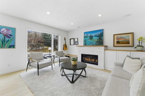 40 Tuscany Ridge Green Nw, Calgary, AB - Indoor Photo Showing Living Room With Fireplace