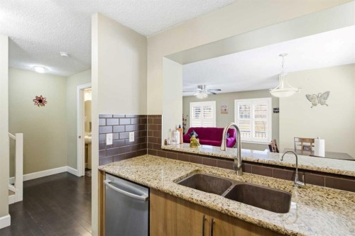1441 Windstone Road Sw, Airdrie, AB - Indoor Photo Showing Kitchen With Double Sink
