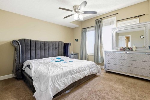 1441 Windstone Road Sw, Airdrie, AB - Indoor Photo Showing Bedroom