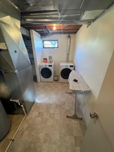 201 Holland Street Nw, Calgary, AB - Indoor Photo Showing Basement