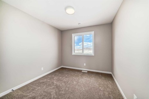 1098 Sawgrass Link Nw, Airdrie, AB - Indoor Photo Showing Other Room
