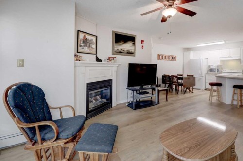 101-6800 Hunterview Drive Nw, Calgary, AB - Indoor With Fireplace