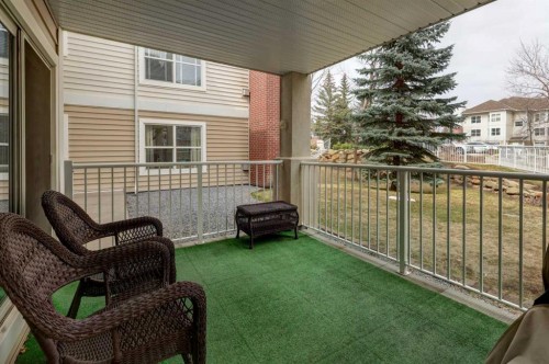 101-6800 Hunterview Drive Nw, Calgary, AB - Outdoor With Deck Patio Veranda With Exterior