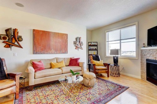 55 Tucker Circle, Okotoks, AB - Indoor Photo Showing Living Room With Fireplace