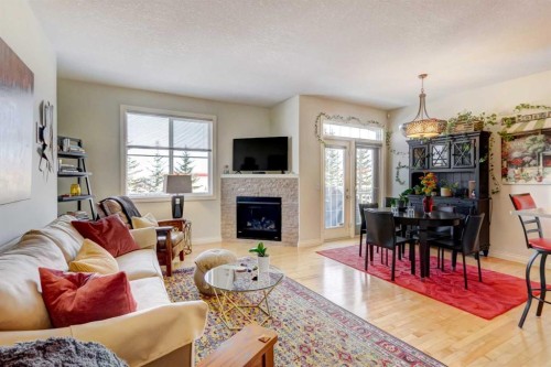 55 Tucker Circle, Okotoks, AB - Indoor Photo Showing Living Room With Fireplace