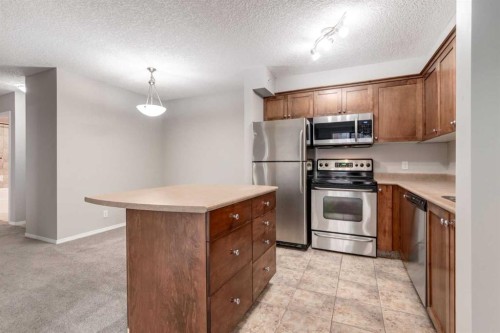 1014-1111 6 Avenue Sw, Calgary, AB - Indoor Photo Showing Kitchen With Stainless Steel Kitchen