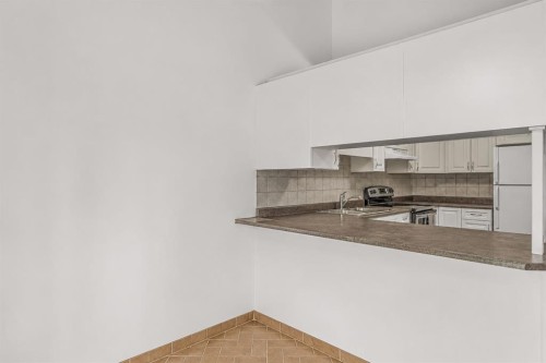 35-216 Three Sisters Drive, Canmore, AB - Indoor Photo Showing Kitchen