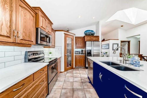 112 West Creek Glen, Chestermere, AB - Indoor Photo Showing Kitchen With Double Sink