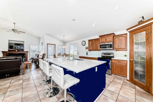 112 West Creek Glen, Chestermere, AB - Indoor Photo Showing Kitchen With Double Sink