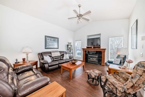 112 West Creek Glen, Chestermere, AB - Indoor Photo Showing Living Room With Fireplace