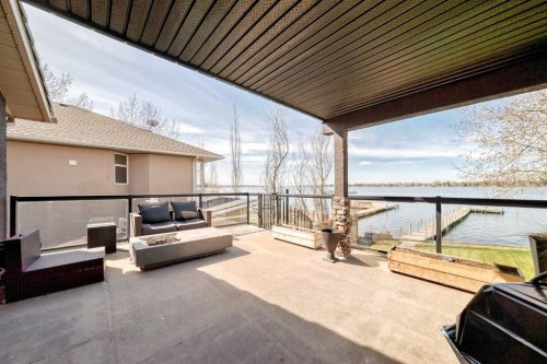 291 East Chestermere Drive, Chestermere, AB - Outdoor With Body Of Water With Deck Patio Veranda With Exterior