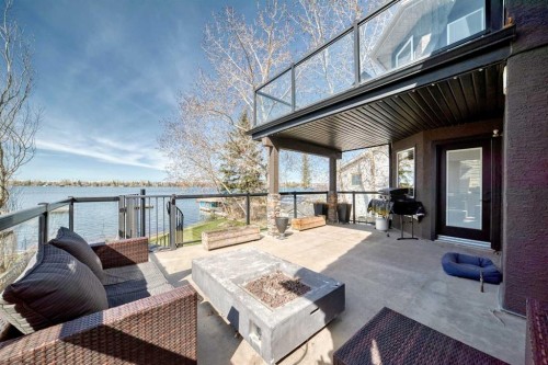 291 East Chestermere Drive, Chestermere, AB - Outdoor With Body Of Water With Deck Patio Veranda With Exterior