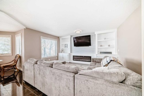 291 East Chestermere Drive, Chestermere, AB - Indoor Photo Showing Living Room With Fireplace