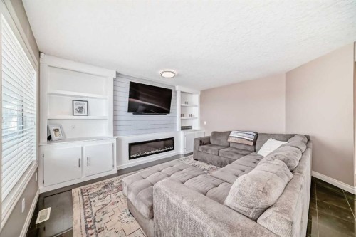 291 East Chestermere Drive, Chestermere, AB - Indoor Photo Showing Other Room With Fireplace