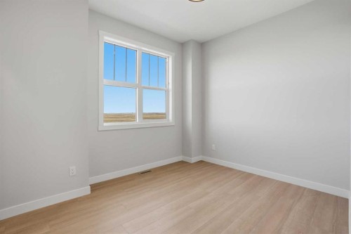 21 Wild Rose Way Se, Calgary, AB - Indoor Photo Showing Other Room