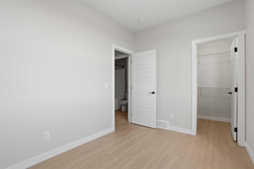 21 Wild Rose Way Se, Calgary, AB - Indoor Photo Showing Other Room