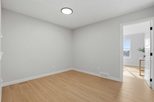 21 Wild Rose Way Se, Calgary, AB - Indoor Photo Showing Other Room