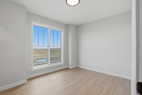 21 Wild Rose Way Se, Calgary, AB - Indoor Photo Showing Other Room