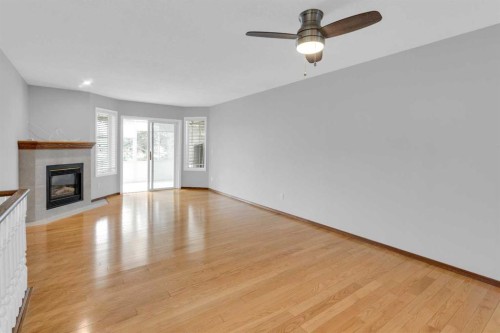 4-604 Griffin Road West, Cochrane, AB - Indoor With Fireplace