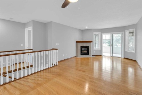 4-604 Griffin Road West, Cochrane, AB - Indoor With Fireplace